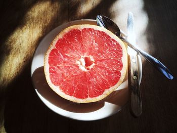 High angle view of fruits in plate on table