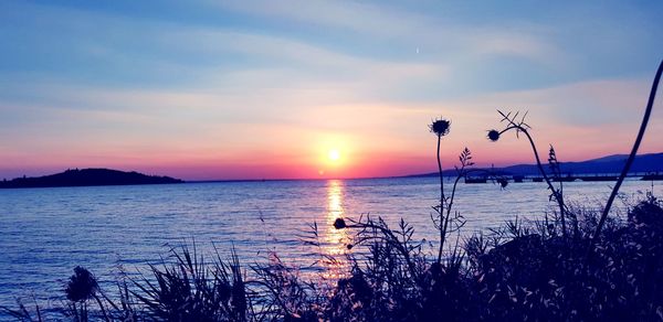 Scenic view of sea against sky during sunset