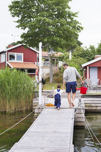 Father with son walking on jetty