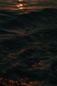 Aerial view of sea against sky at sunset