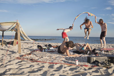 Group of friends hanging out together on a beach