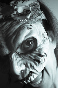 Close-up portrait of woman wearing mask