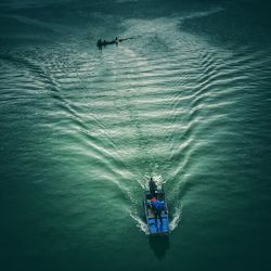 High angle view of people on boat sailing in sea