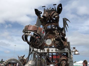 Low angle view of machinery against sky