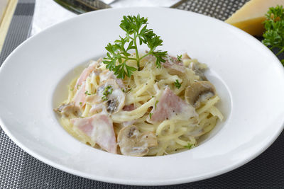 Close-up of spaghetti with cheese and meat in plate