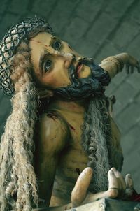 Close-up of jesus christ against wall