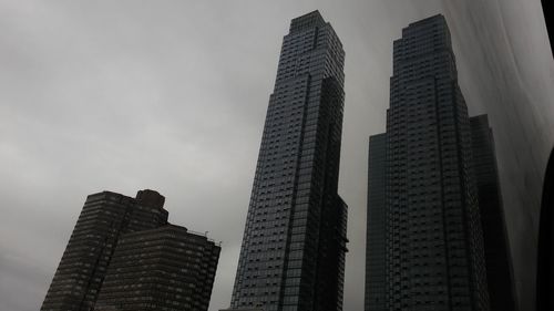 Low angle view of modern buildings against sky