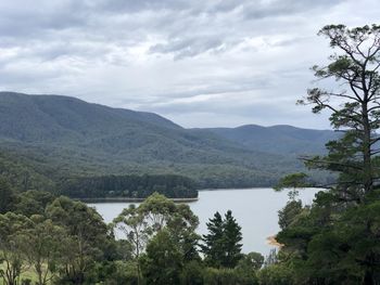 Scenic view of lake and mountains against sky