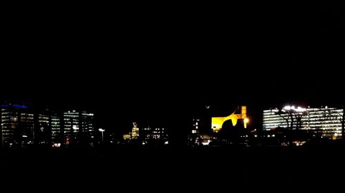 View of illuminated buildings at night