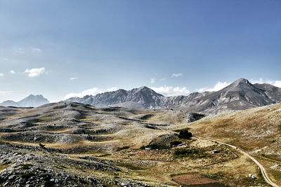 Scenic view of snowcapped mountains against sky