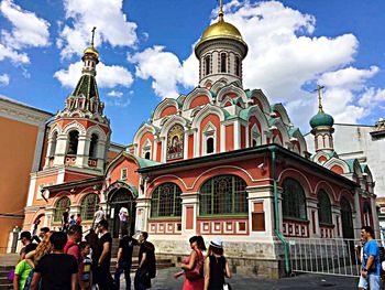 Facade of church against cloudy sky