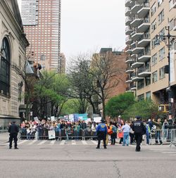 People on road along buildings