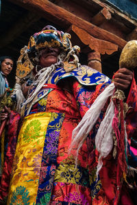 Woman with multi colored decoration