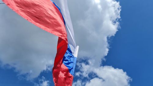 Low angle view of flag against sky