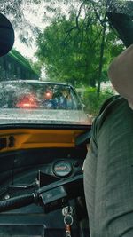 Cropped image of woman driving car