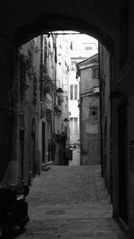 Alley amidst buildings in city