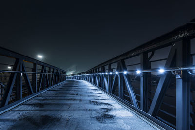 Illuminated bridge at night