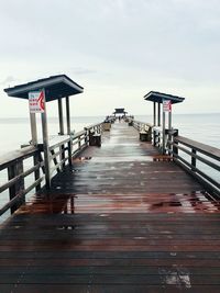 Pier over sea against sky