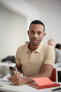 Portrait of mid adult man in class