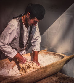 Man working on cutting board