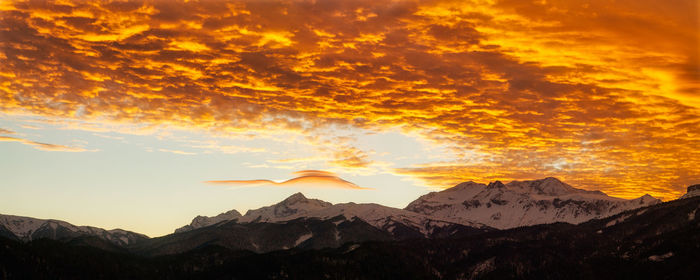 Scenic view of mountains against sky during sunset