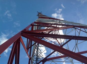 Low angle view of communications tower against sky