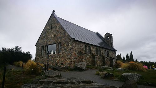 Low angle view of old building against sky