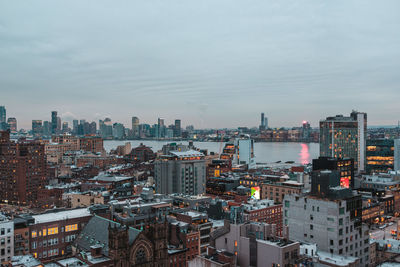 High angle view of buildings in city against sky