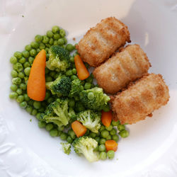 Directly above shot of vegetables with croquettes in plate