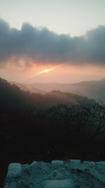 Scenic view of mountains against sky during sunset