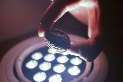 Close-up of person holding glass