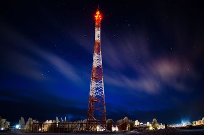 Low angle view of illuminated building against sky at night