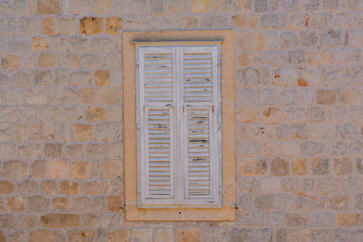 Full frame shot of window on brick wall