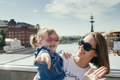 Portrait of smiling girl in city