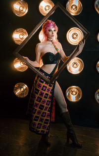 Low section of woman standing on stage