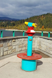 View point with colorful telescope