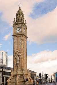 View of clock tower against cloudy sky