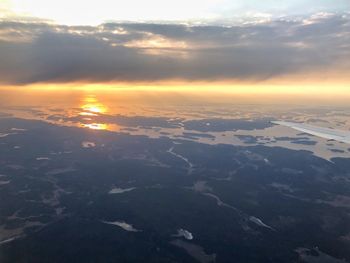 Aerial view of landscape against sky during sunset