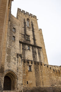 Low angle view of old building against sky