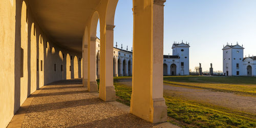 Sunset between the columns. ancient residence of the doge of venice. udine. italy