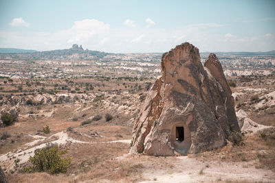 Rock formation on landscape against the sky