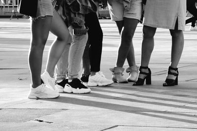 Low section of people standing on street