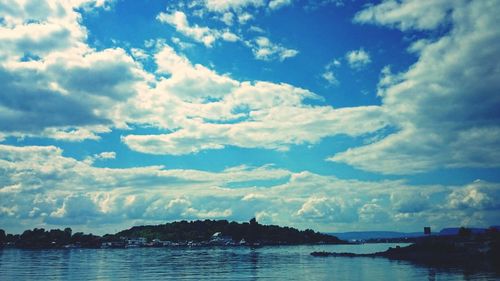 Scenic view of sea against cloudy sky