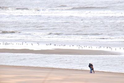 Full length of couple on beach