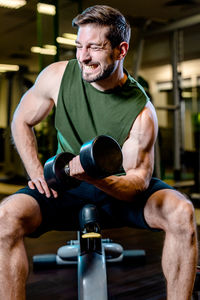 Portrait of man exercising in gym
