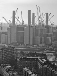 Construction site in city against sky