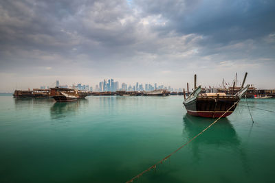 Boats on sea against sky