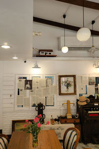 View of illuminated pendant lights in restaurant