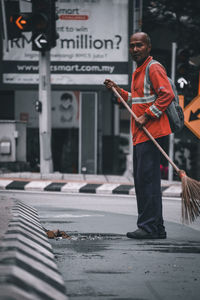 Man working on street in city