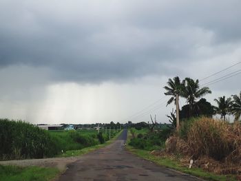 View of road against cloudy sky